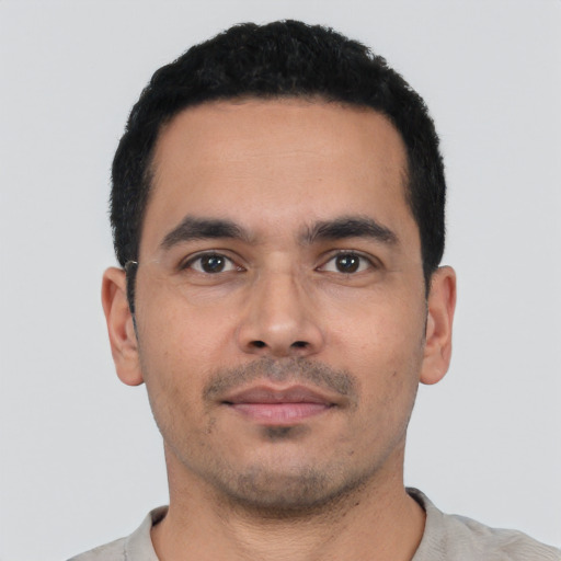 Neutral latino young-adult male with short  black hair and brown eyes