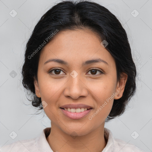 Joyful latino young-adult female with medium  brown hair and brown eyes