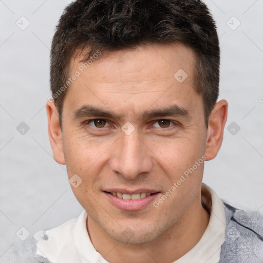 Joyful white adult male with short  brown hair and brown eyes