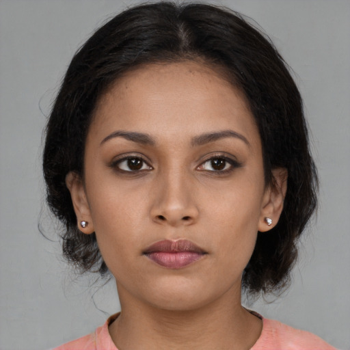 Neutral latino young-adult female with medium  brown hair and brown eyes