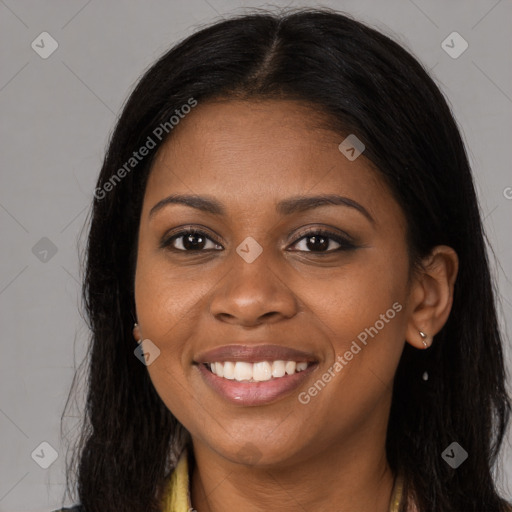 Joyful black young-adult female with long  brown hair and brown eyes