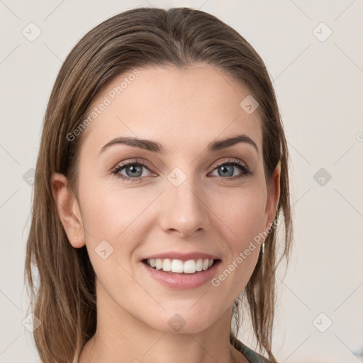 Joyful white young-adult female with long  brown hair and grey eyes