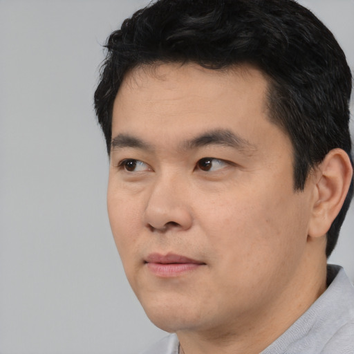 Neutral asian young-adult male with short  black hair and brown eyes