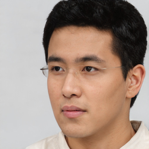 Neutral asian young-adult male with short  black hair and brown eyes