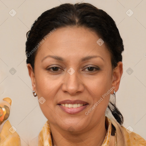 Joyful latino adult female with medium  brown hair and brown eyes