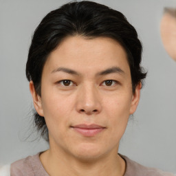 Joyful asian young-adult female with short  brown hair and brown eyes