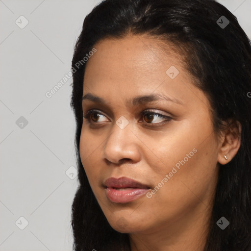 Joyful latino young-adult female with long  black hair and brown eyes