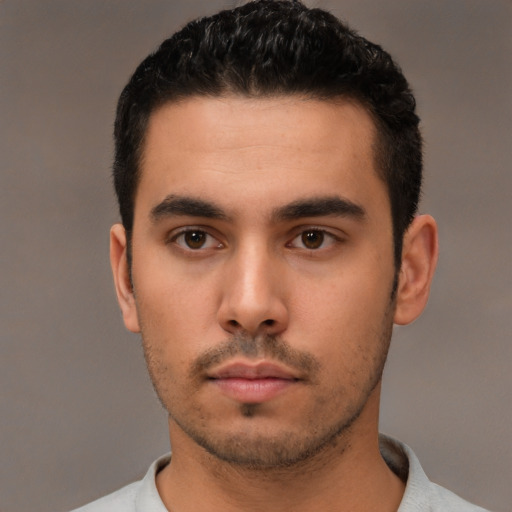 Neutral white young-adult male with short  black hair and brown eyes