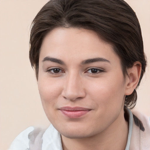 Joyful white young-adult female with medium  brown hair and brown eyes