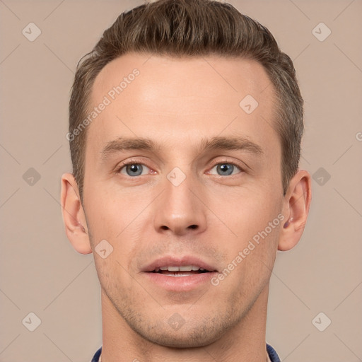 Joyful white young-adult male with short  brown hair and grey eyes