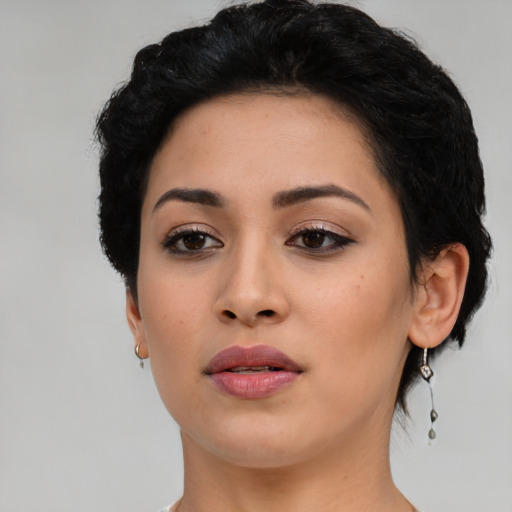 Neutral latino young-adult female with short  black hair and brown eyes