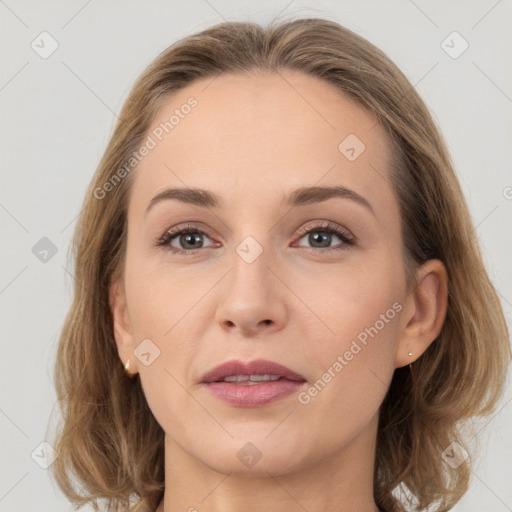 Joyful white young-adult female with medium  brown hair and grey eyes