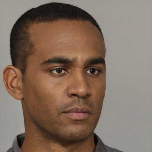 Neutral black young-adult male with short  black hair and brown eyes