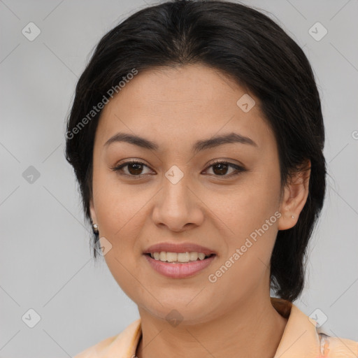 Joyful latino young-adult female with medium  brown hair and brown eyes