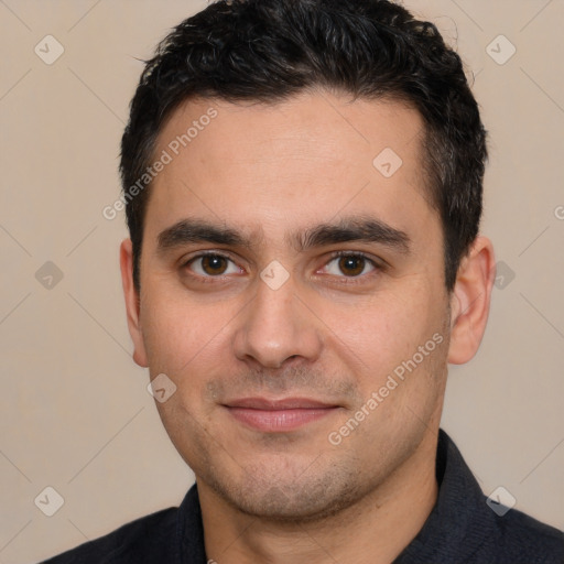 Joyful white young-adult male with short  black hair and brown eyes