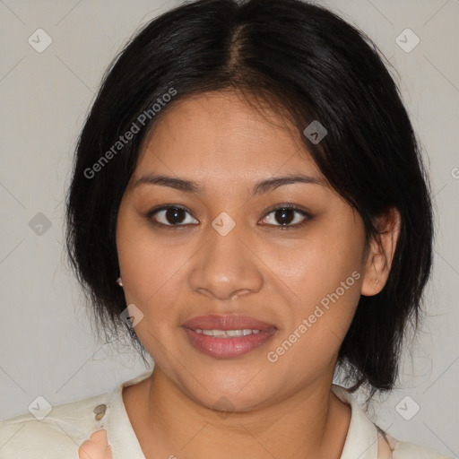 Joyful latino young-adult female with medium  brown hair and brown eyes