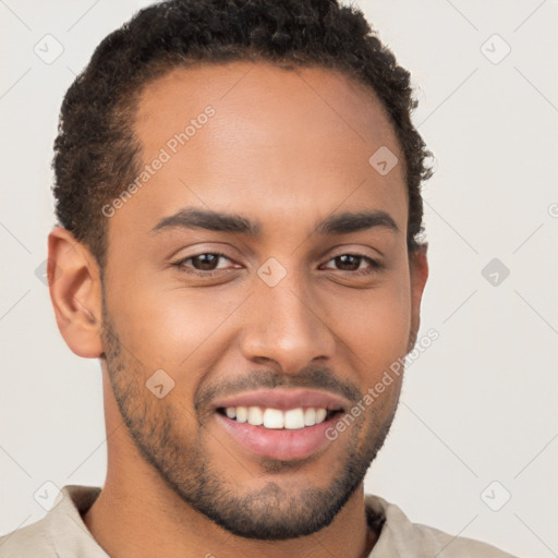 Joyful latino young-adult male with short  brown hair and brown eyes