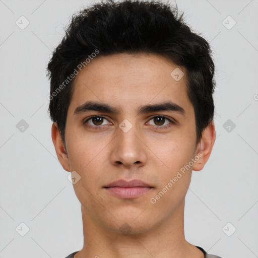 Neutral latino young-adult male with short  black hair and brown eyes