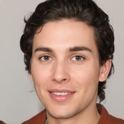 Joyful white young-adult male with medium  brown hair and brown eyes