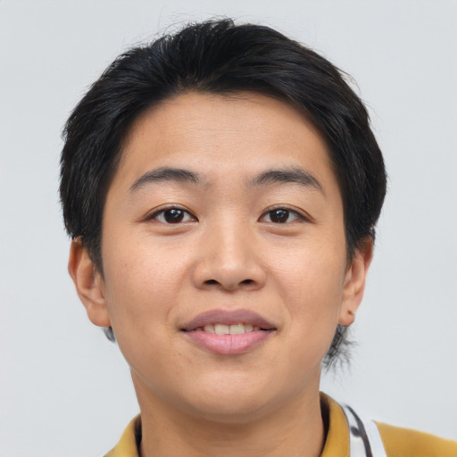 Joyful asian young-adult male with short  black hair and brown eyes