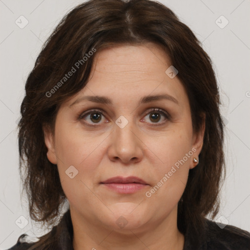 Joyful white adult female with medium  brown hair and brown eyes