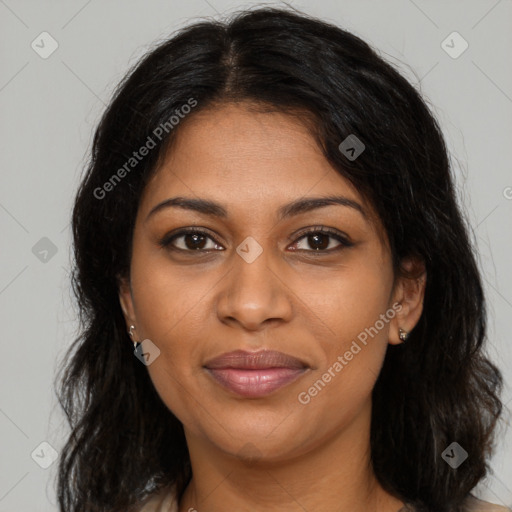 Joyful black young-adult female with long  brown hair and brown eyes