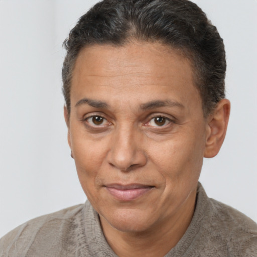 Joyful white adult female with short  brown hair and brown eyes