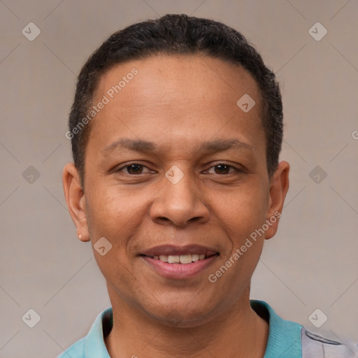 Joyful latino adult male with short  black hair and brown eyes