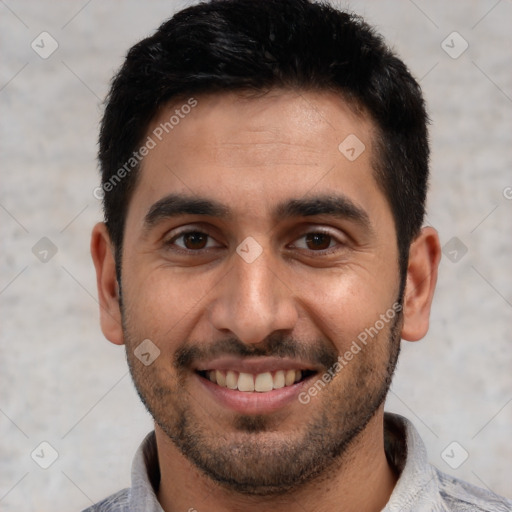 Joyful white young-adult male with short  black hair and brown eyes