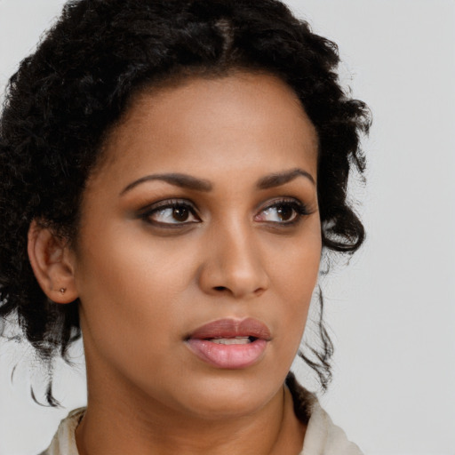 Neutral latino young-adult female with medium  brown hair and brown eyes