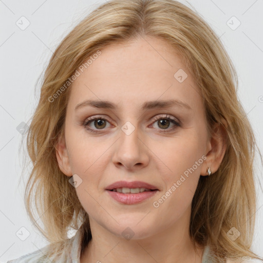 Joyful white young-adult female with medium  brown hair and blue eyes