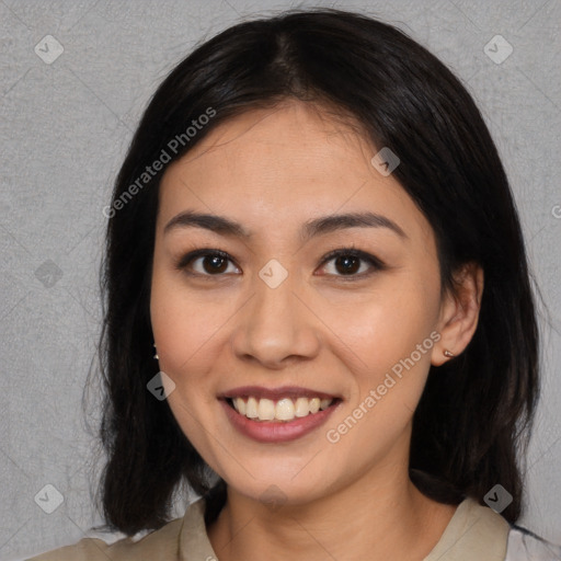 Joyful asian young-adult female with long  brown hair and brown eyes