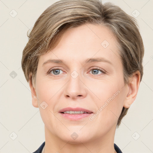 Joyful white adult female with short  brown hair and grey eyes