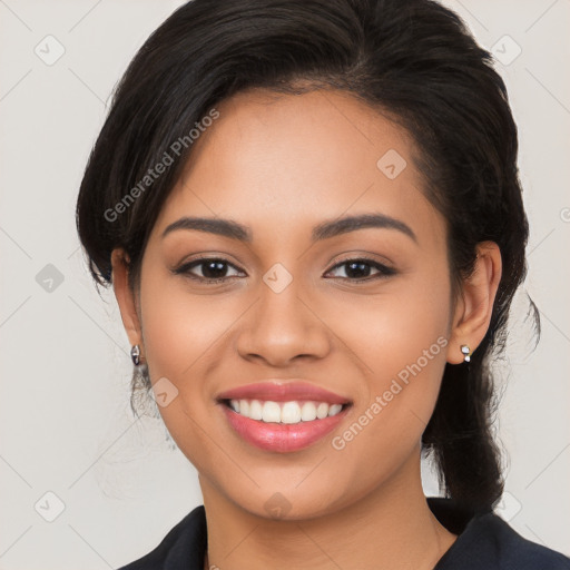 Joyful latino young-adult female with long  brown hair and brown eyes