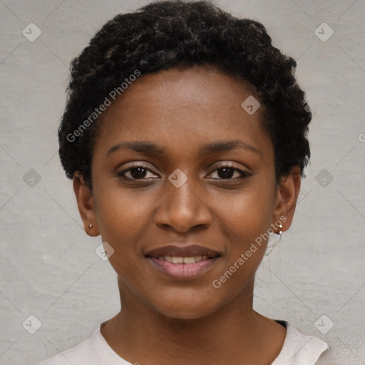 Joyful black young-adult female with short  black hair and brown eyes