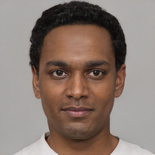 Neutral black young-adult male with short  black hair and brown eyes