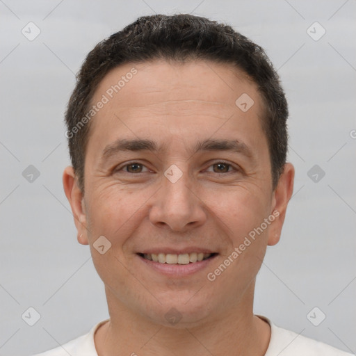 Joyful white adult male with short  brown hair and brown eyes