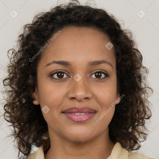 Joyful black young-adult female with medium  brown hair and brown eyes