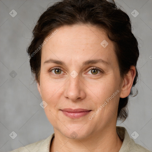 Joyful white adult female with medium  brown hair and green eyes