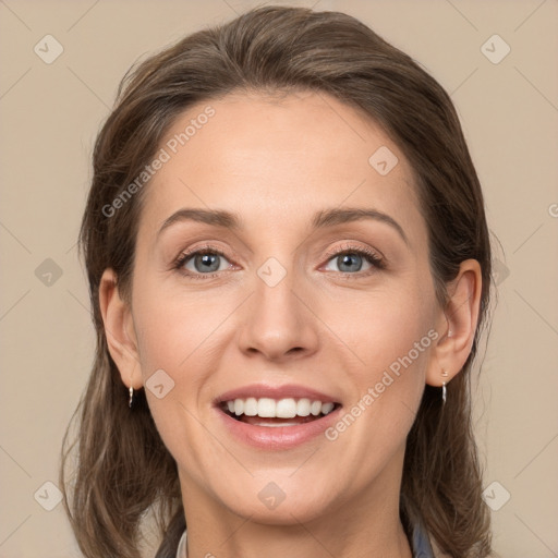 Joyful white young-adult female with long  brown hair and grey eyes