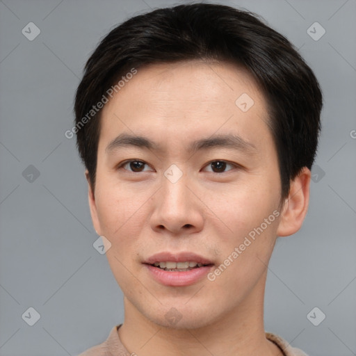 Joyful asian young-adult male with short  brown hair and brown eyes