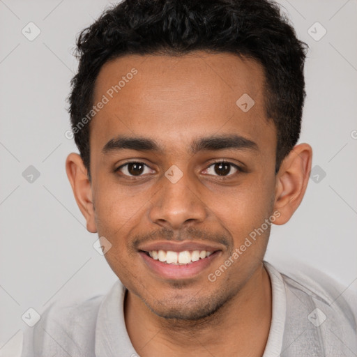 Joyful latino young-adult male with short  brown hair and brown eyes