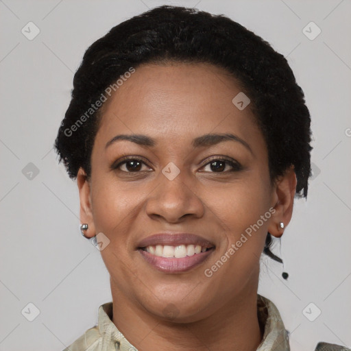 Joyful black young-adult female with short  brown hair and brown eyes