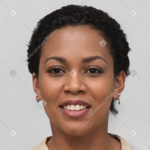 Joyful black young-adult female with short  black hair and brown eyes