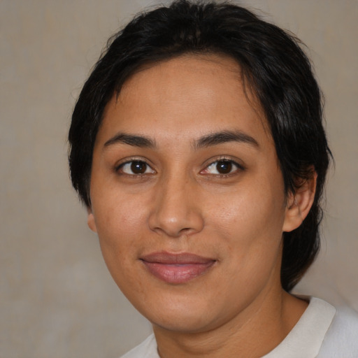 Joyful asian young-adult female with medium  brown hair and brown eyes