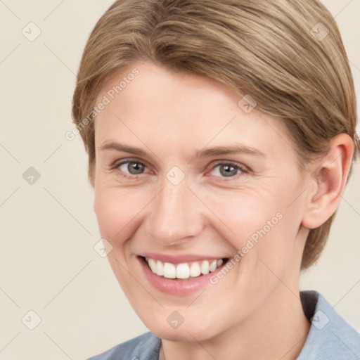 Joyful white young-adult female with medium  brown hair and grey eyes