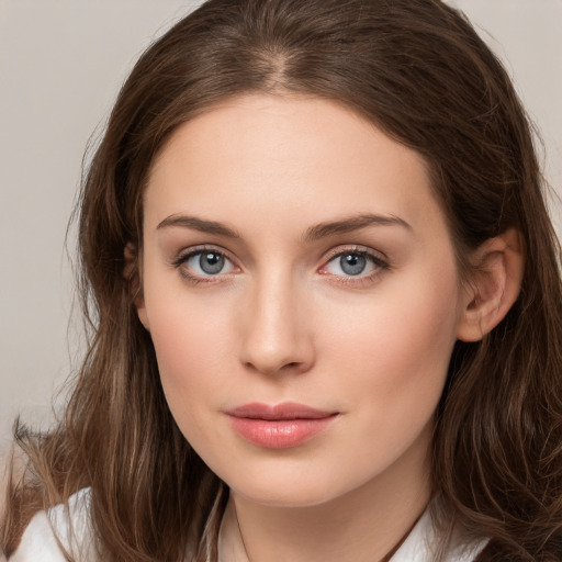 Neutral white young-adult female with long  brown hair and brown eyes