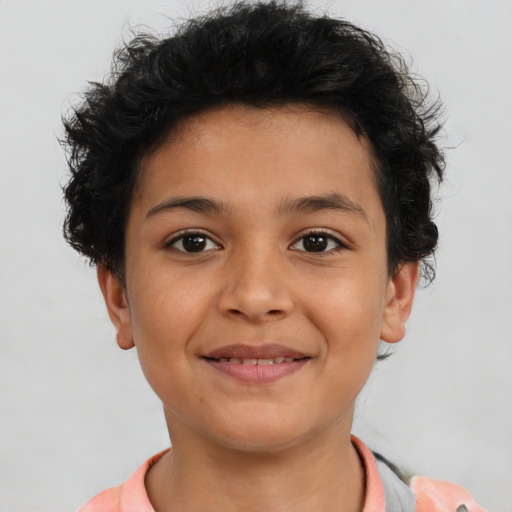 Joyful latino child female with short  brown hair and brown eyes