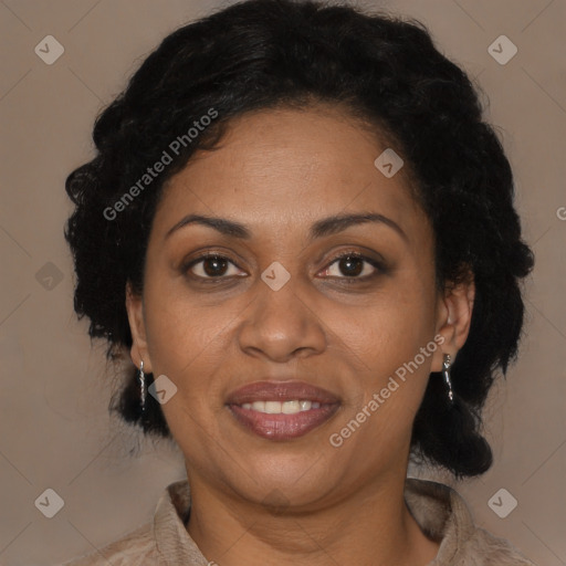 Joyful black adult female with medium  brown hair and brown eyes