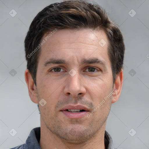 Joyful white adult male with short  brown hair and brown eyes